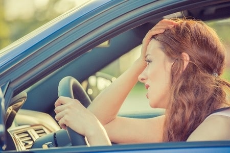 Stressed woman in a car