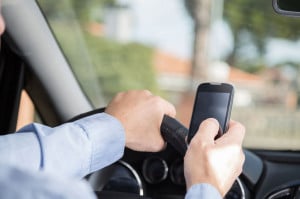 37175578 - man with mobile distracted and driving your car